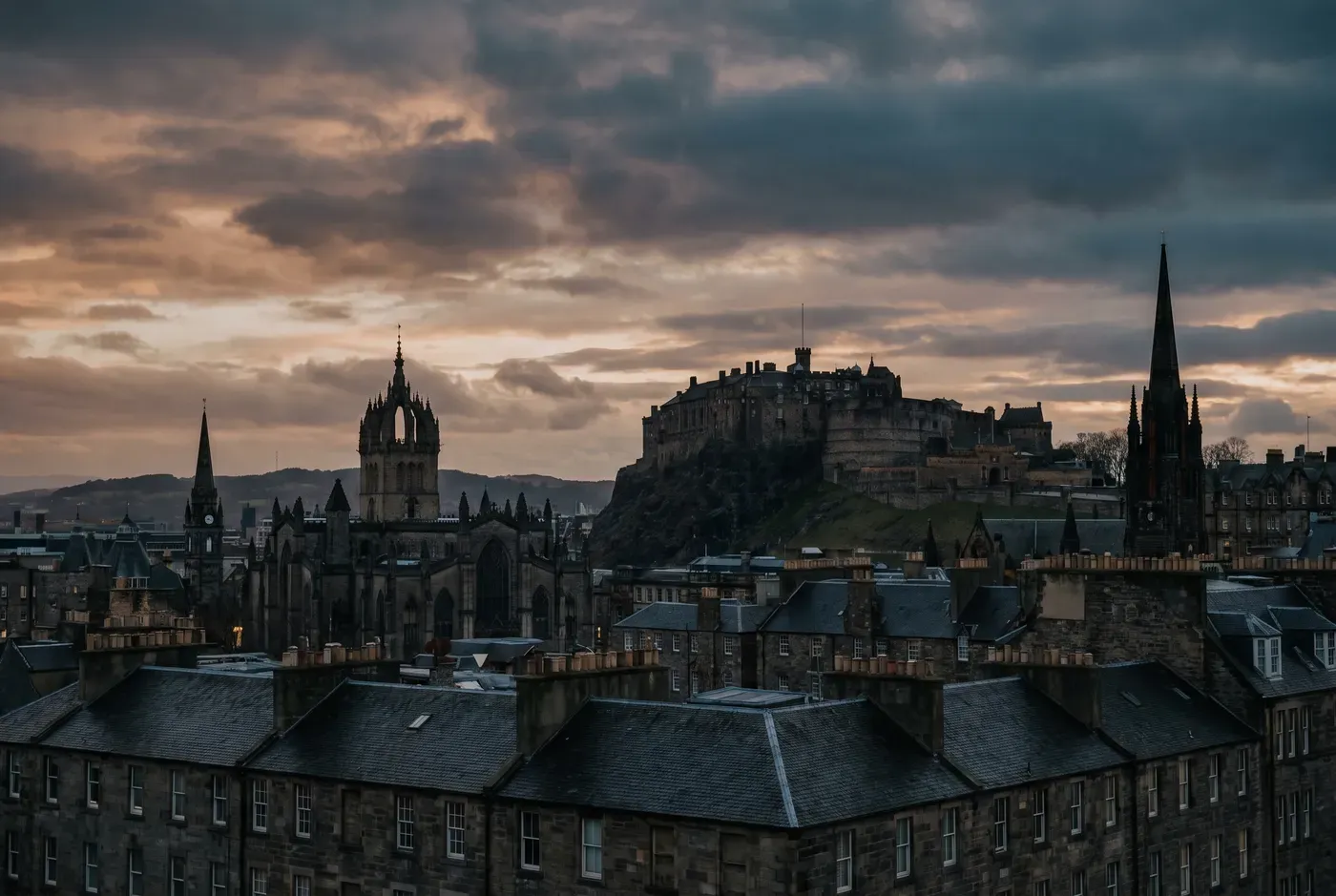 Edinburgh Old Town and Castle skyline at dusk from Calton Hill