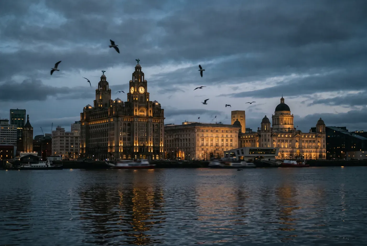 Liverpool Pier Head waterfront at dusk with the Royal Liver Building